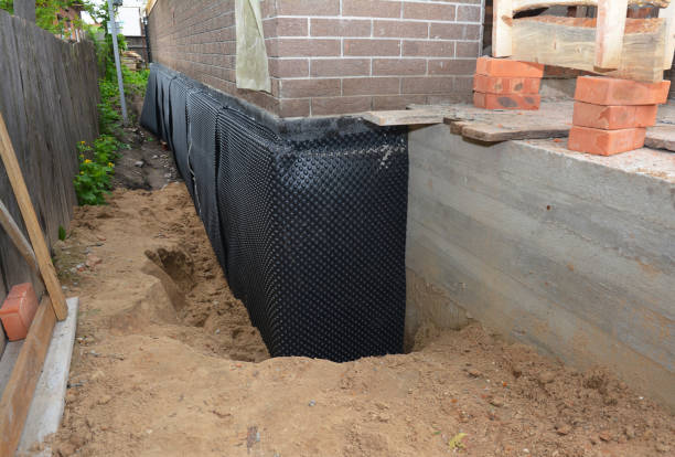 SJ Waterproofing Pros technician performing targeted Waterproofing assessment in Hopkins, MN